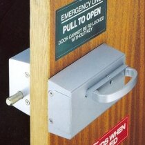 Pull release for use with Cooper Bolt Panic Bolts Outward Opening in use, installed on a door