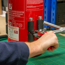 Easy to operate ratchet to secure extinguisher in place, and release when finished