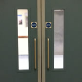 Double fire door set with impact resistant laminate wrap